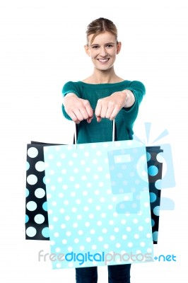Young Shopaholic Girl With Vibrant Bags Stock Photo