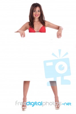 Young Smiling Woman In Red Bikini Holding White Blank Board Stock Photo