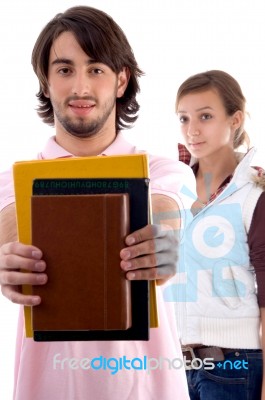 Young Students Showing Notebook Stock Photo