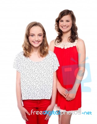 Young Teenage Sisters Standing Stock Photo