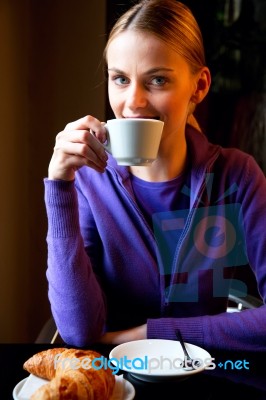 Young Woman Drinking Coffee Stock Photo