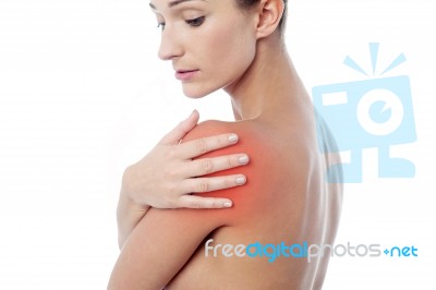 Young Woman Having Shoulder Pain Stock Photo