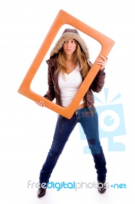Young Woman Holding Frame Stock Photo