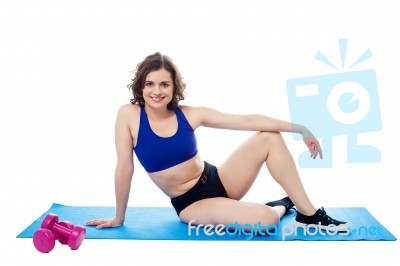 Young Woman Relaxing After Workout Stock Photo