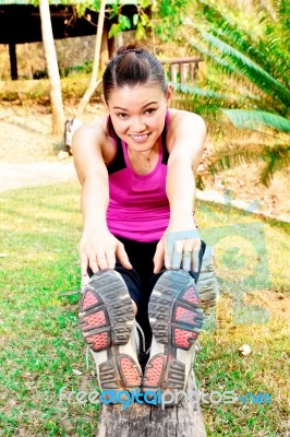 Young Woman Stretching Before Exercise Stock Photo