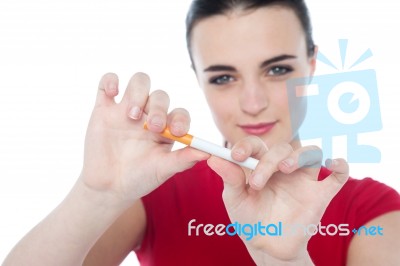 Young Woman Try To Break Cigarette Stock Photo