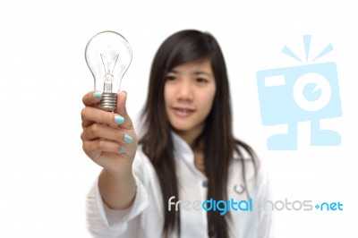 Young Woman With Light Bulb Stock Photo