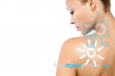 Young Woman With Suntan Lotion Stock Photo