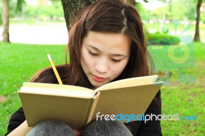 Young Woman Writing Stock Photo