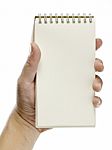 A Hand Holding A Notebook, Stock Photo