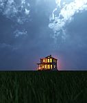 A Single House On Field At Night Stock Photo