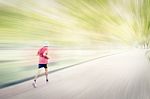 Abstract Image Of Man Jogging  In The Park,. Motion Blur Effect Stock Photo