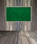 Abstract The Green Blackboard On Grunge Wall Stock Photo