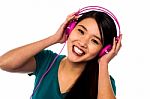 Adorable Girl Listening To Music Stock Photo
