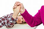 Adult Arm Wrestling With Young Girl Stock Photo