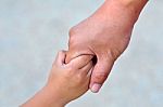 Adult Holding Childs Hand Stock Photo