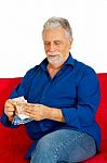An Old Man Holding Money Stock Photo