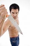 Angry Male Showing Dagger Stock Photo