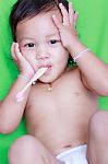 Asian Baby And Toothbrush Stock Photo