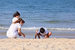 Asian Family On Beach Stock Photo