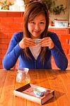 Asian Girl Drinking Tea In Morning Stock Photo