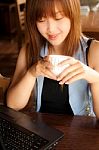 Asian Girl, Notebook And Coffee Stock Photo