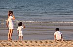 Asian Mom And Son On Beach Stock Photo