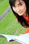 Asian Woman Reading Stock Photo