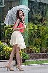 Asian Woman With A Clear Umbrella Stock Photo