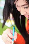 Asian Woman Writing Stock Photo