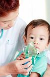 Baby And Medical Instrument Stock Photo