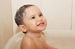 Baby Bathes In Bathroom Stock Photo