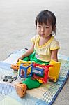 Baby Girl Playing Toy Stock Photo