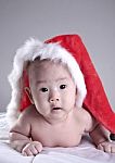 Baby In Christmas Hat Stock Photo
