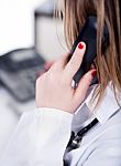 Back Shot Of A Female Doctor Over A Phone Call Stock Photo