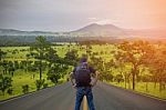 Backpacker Standing On The Road Stock Photo