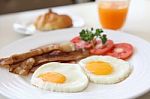 Bacon And fried egg With Juice Stock Photo