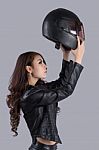 Beautiful Female Biker Wearing A Leather Jacket Stock Photo