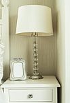 Bedside Table With Lamp, And Picture Frame Stock Photo