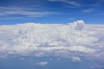 Big White Cloud And Blue Sky Background,view From Airplane Stock Photo