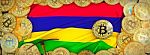 Bitcoins Gold Around Mauritius  Flag And Pickaxe On The Left.3d Stock Photo