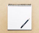 Blank Notepad With Pen On Office Table Stock Photo