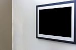 Blank Photo Frame On White Wall In Art Gallery Stock Photo