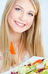 Blond Woman Eating Salad Stock Photo