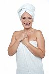 Blonde Woman In Towel Smiling Heartily Stock Photo