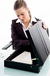Blonde Woman Looking Into Suitcase Stock Photo