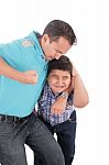 Boy Aggressively Held By Father Stock Photo