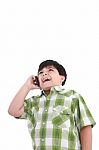 Boy Laughs And Talks With Mobile Stock Photo