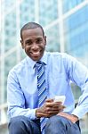 Business Executive Using His Smart Phone Stock Photo