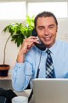 Businessman Attending Phone Call Stock Photo
